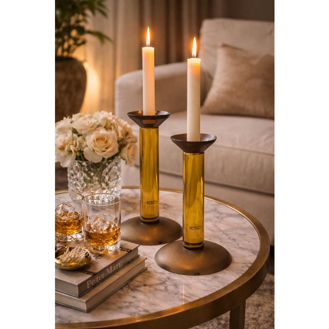 Striking and highly collectible pair of Scavo Murano glass candle holders designed by Karl Springer and expertly crafted...