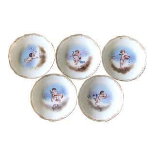 Early 20th Century Dresden Porcelain Hand Painted Cherub Cupid Butter Pats- Set of 5 For Sale