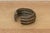 This bronze exchange is a storied artifact of West African economic history. Known as a Manilla, these open-cuff bracelets...
