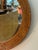 This is a beautiful Italian imported burnt bamboo rattan round mirror. In excellent condition. Measures: 30" diameter
