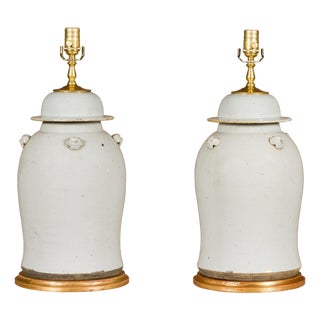 Asian Modern White Porcelain Lidded Urns on Gilded Bases - Pair For Sale