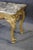 Measures: 34" h x 53 3/4" w x 31" d. This French Louis XV marble top giltwood center table carries the unmistakable rhythm...