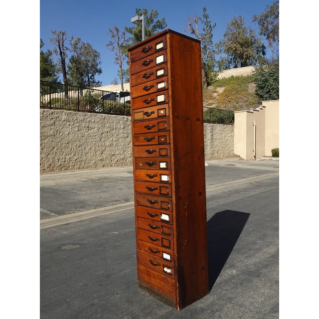 Gorgeous File Cabinet in Good Vintage Condition. Solid and Firm. There is wear to the finish. Please study the photos and...