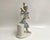 This porcelain Pierrot figurine, hand-painted with underglaze techniques, embodies the charm and artistry of Spanish...