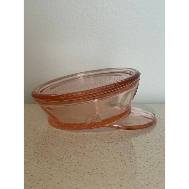 A wonderfully unusual early 20th-century pressed-glass powder box modeled in the form of a U.S. military service cap....