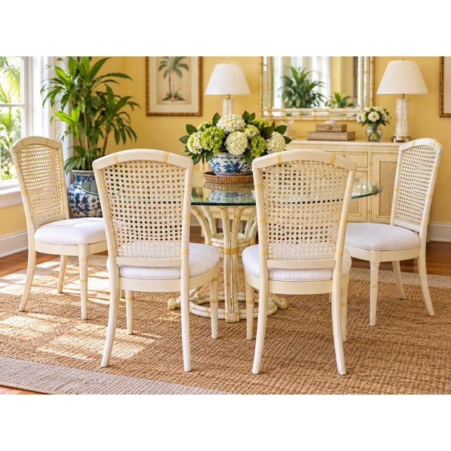 Set of Four Henry Link–Style Faux-Bamboo Dining Chairs by Chaircraft Ivory-painted dining chairs featuring tall woven cane...