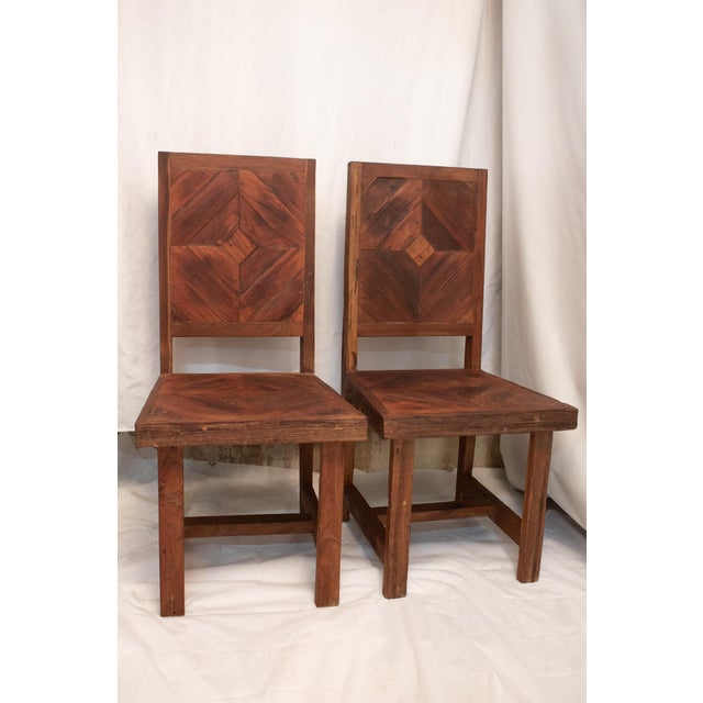 Solid teak patterned into a diamond design with alternating Inlaid strips. Very nice decorative designs show the contrast...