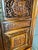 This is an antique Chinese carved wooden wedding cabinet dating back to the late 19th-century Qing Dynasty. It features...