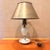 Vintage hobnail milk glass table lamp has a white glass base with a ruffled saucer bottom. The lamp includes a conical...