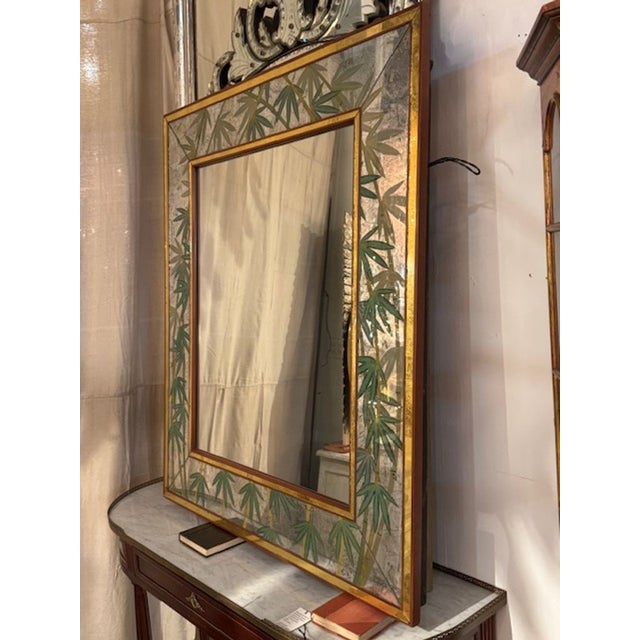 The Vintage Italian Jansen manner Eglomise Palm Mirror is a luxurious and elegant piece mirror with a beautiful design....