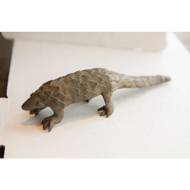 :: Vintage handmade African pangolin sculpture. Circa late mid 20th century, though possibly older, this piece has such...