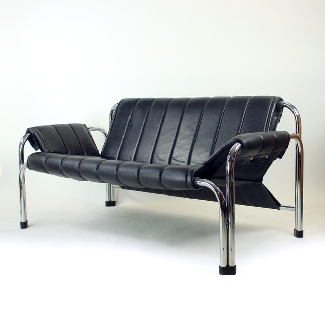 A stylish & iconic two-seater loveseat from the t 2403 series, designed by viliam chlebo and produced by kodreta myjava in...