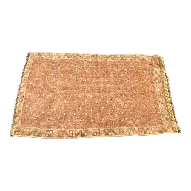 This is a vintage Turkish Oushak rug from the 1960s. The piece was hand-knotted.