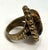 Stephen Dweck Ring. A beautifully floral-carved cabochon tiger's eye. Sterling Silver with a bronze patina. Rope twist...