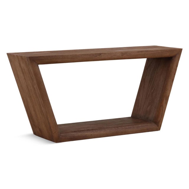 Unique modern open frame trapezoid design console table. Solid sturdy Mindi wood with a handsome walnut brown finish. Each...