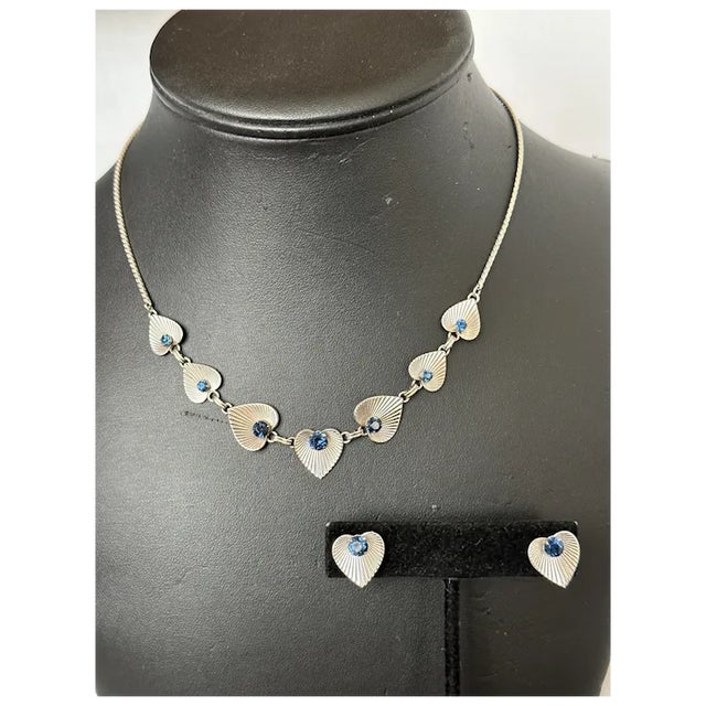 Van Dell sterling demi-parure. Necklace and screw back earrings. Both feature a textured heart/leaf design, accented with...