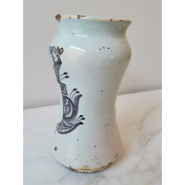 Antique Spanish pharmacy jars, called “albarelos”, were made for storing herbs and other substances used in making...