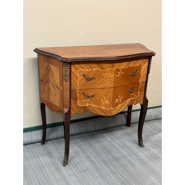 Design Plus Gallery presents a Two Drawer Chest in the Louis XV Style from the Early 20th Century. The chest is solid wood...