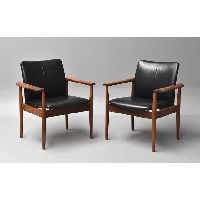 This is a Finn Juhl diplomat desk chair or armchair with frame in solid hardwood. It is the model 209. It was designed in...