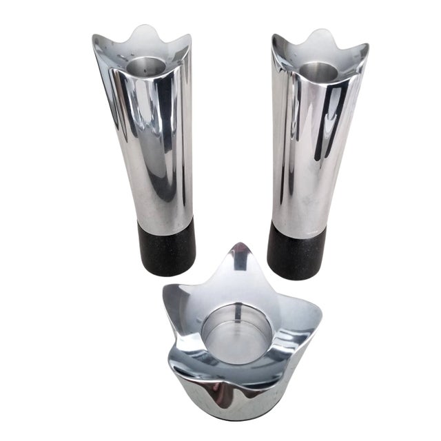 A set of 3 Nambe candle holders designed by Neil Cohen in 2009 made with Nambe's proprietary mix of metals and black...