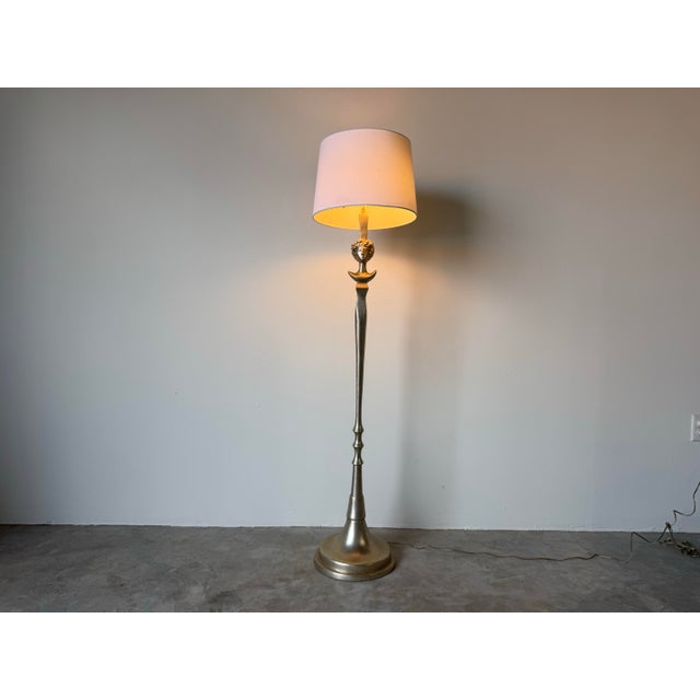 Evocative and sculptural, this vintage floor lamp is a striking homage to the style of Diego Giacometti, featuring a...