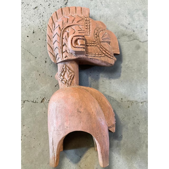 Hand-carved wooden sculpture – inspired by ceremonial carrying figures – approx. 40 cm A unique hand-carved wooden...