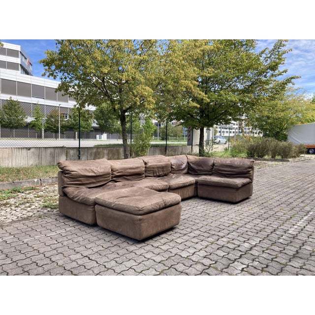 This stunning modular sectional leather sofa was designed and manufactured by Rolf Benz in Germany in the 1970s. Featuring...