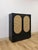 This modern tallboy cabinet from Bobby Berk's furniture collection combines a sleek satin black finish with striking beige...
