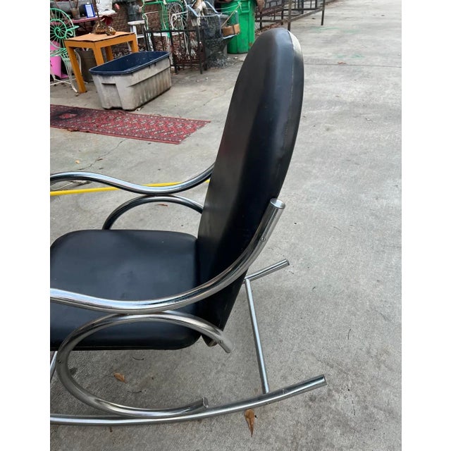 Up for consideration is a beautiful vintage chrome and black leather modern style rocking chair. This would look lovely in...