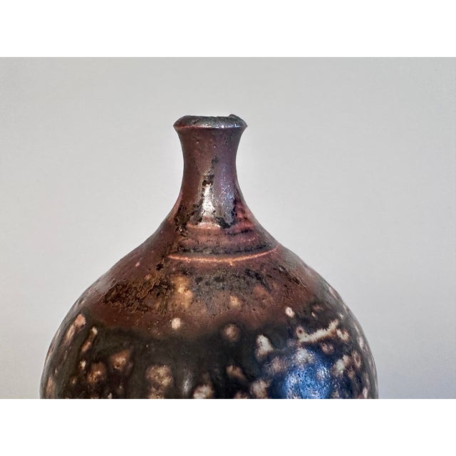 An impressive single flower vase by the Australian ceramicist Gillian Dodds from New South Wales, handcrafted during the...