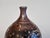 An impressive single flower vase by the Australian ceramicist Gillian Dodds from New South Wales, handcrafted during the...
