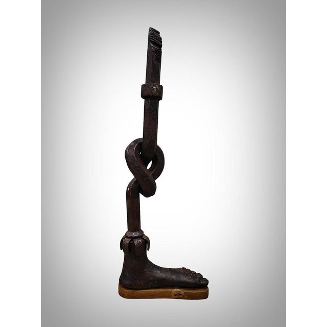 Introducing an elegant forged iron sculpture, meticulously crafted by a master blacksmith at the forge. This work,...