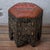 A pair of Moroccan stools with octagonal leather-upholstered tops and kilim centers. The hinged lift-top seats open to...