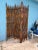 The Large bamboo canes tied together creating 3 panels. Between the Cane Frame are Bamboo rattan sticks wrapped together...