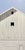 Lovely Day by Justin Wheatley | Acrylic on Panel White barn with windows under a blue sky For Sale