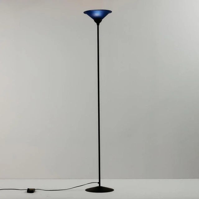 Postmodern style floor lamp from the 1980s. The lamp gives off a warm, soft light, making it an excellent choice for mood...