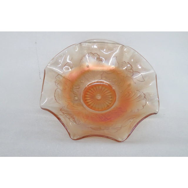 This wonderful Bowl is made of carnival glass. This bowl is made by Northwood and it is marked N on the bottom, it...