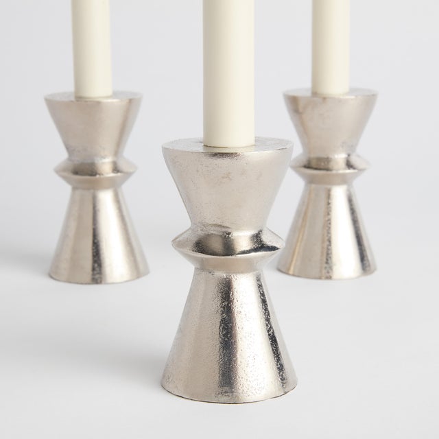 With a short, geometric base, this piece is a minimalist design. Paired with a standard size taper candle, a fitting...