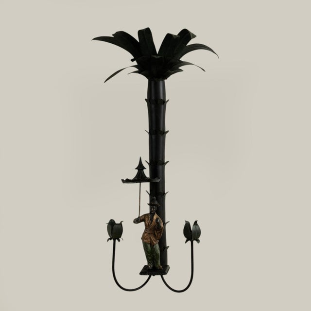 Whimsical pair of vintage tole two light Italian candle power wall sconces having stylized palm trees over fanciful...