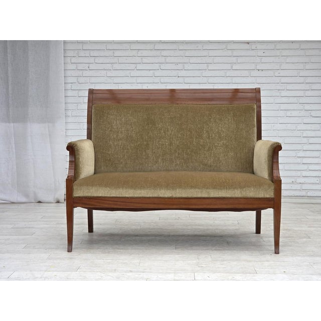1950s, 2 seater Danish highback sofa. Green furniture velour, laqered teak wood, brass springs in the seat. Sofa was...