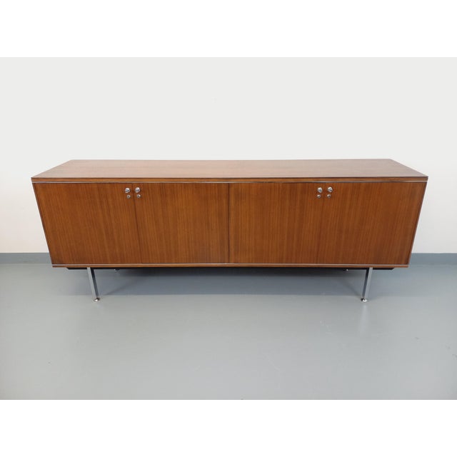 Vintage low sideboard in a modernist style from the 1960s/70s, attributed to designer Alain Richard, in the style of...