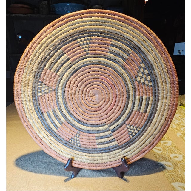 Finely handwoven using the traditional close-stitched coil technique, this tray is crafted from natural desert fibers like...
