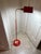 This item is a Mid-Century Modern red enamel and polished brass pharmacy floor lamp, a style popularized in the 1950s...