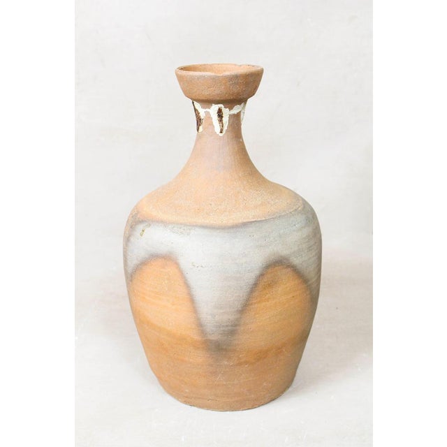 Unearth the past with this antique Asian rice wine clay container, a testament to the craftsmanship of a bygone era. Its...