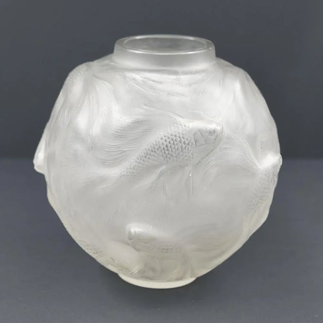 “formose” vase model created on august 7, 1924, blown-pressed white glass with opalescent patina and fish decoration....
