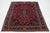 This is a beautiful vintage Kashan hand-knotted wool rug with a burgundy red field. It has multicolor accents and an all-...