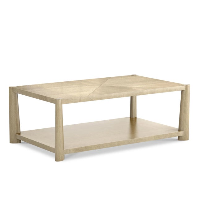 A charming low modern table with a rectangular top that is veneered with rich quarter sawn English sycamore elevated on...
