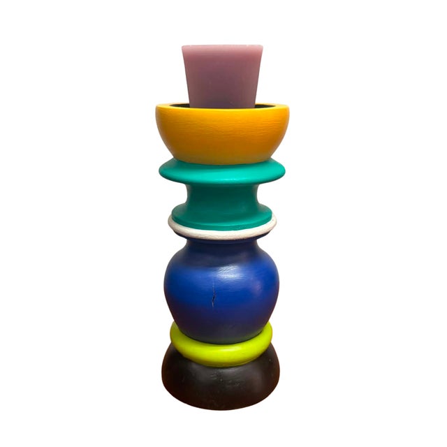 A striking pair of vintage hand-painted wooden candlesticks inspired by the bold forms and playful color palette of the...