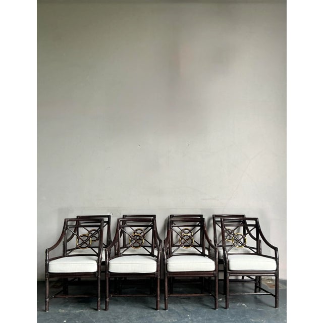 Presenting an exceptional set of eight vintage dining chairs, crafted in the distinguished McGuire-style and featuring...