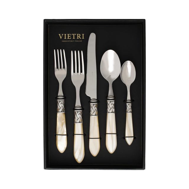 The Aladdin Antique Flatware Five-Piece Place Setting - service for one guest - features elegant pearlized handles with...